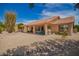 Charming home with a serene backyard featuring desert landscaping and a covered patio at 9243 W Kimberly Way, Peoria, AZ 85382