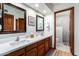 Bathroom featuring double sinks, a walk-in shower, and modern fixtures at 9243 W Kimberly Way, Peoria, AZ 85382