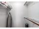 Walk-in closet with shelving, wooden rods, and an ironing board at 9243 W Kimberly Way, Peoria, AZ 85382