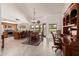 Open dining area with natural light, tile floors, and a dark wood hutch at 9243 W Kimberly Way, Peoria, AZ 85382