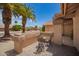 Quaint outdoor sitting area on a front porch with desert landscaping at 9243 W Kimberly Way, Peoria, AZ 85382