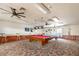 Community game room with two billiard tables, ceiling fans and patterned carpeting at 9243 W Kimberly Way, Peoria, AZ 85382
