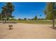 Scenic view of the community golf course featuring mature trees and lush green fairways at 9243 W Kimberly Way, Peoria, AZ 85382