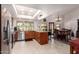 Open kitchen with granite countertops, stainless steel appliances, and seamless flow to the dining area at 9243 W Kimberly Way, Peoria, AZ 85382
