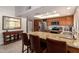 Spacious kitchen featuring granite countertops, stainless steel appliances, and a breakfast bar with seating at 9243 W Kimberly Way, Peoria, AZ 85382