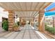 Covered patio area featuring decorative columns, desert landscaping and open walkways at 9243 W Kimberly Way, Peoria, AZ 85382