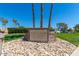 The Lakes Golf Course and Restaurant signage surrounded by desert landscaping and palm trees at 9243 W Kimberly Way, Peoria, AZ 85382