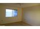 This bedroom features a ceiling fan and window providing natural light at 9426 N 109 Th Dr, Sun City, AZ 85351