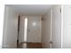 Hallway featuring neutral walls, a front door, and access to other rooms at 9426 N 109 Th Dr, Sun City, AZ 85351