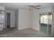Living room with a ceiling fan and view of the back patio at 9426 N 109 Th Dr, Sun City, AZ 85351