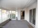 Enclosed patio featuring brick accents and a view of the green yard at 9426 N 109 Th Dr, Sun City, AZ 85351