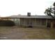Exterior view of the rear of the home featuring a screened in patio at 9426 N 109 Th Dr, Sun City, AZ 85351