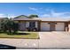 Charming brick home with a well-maintained front yard, covered entry and two-car garage at 9602 W Ironwood Dr # A, Peoria, AZ 85345