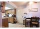 Functional kitchen and dining area featuring wood cabinets and a cozy eating space at 9602 W Ironwood Dr # A, Peoria, AZ 85345