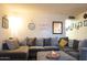 Comfortable living room featuring a large sectional sofa and a view of hallway at 9602 W Ironwood Dr # A, Peoria, AZ 85345