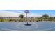 Community basketball court with well-maintained surface and modern hoop in a fenced play area at 9964 W Piccadilly Rd, Avondale, AZ 85392