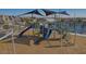 Fun playground with slides and climbing structures in a safe, wood chip-covered area, perfect for children at 9964 W Piccadilly Rd, Avondale, AZ 85392