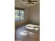 Well-lit bedroom featuring a ceiling fan and a window with bright natural light at , Mesa, AZ 85205