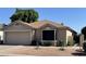 Charming single-story home with a two-car garage and well-maintained desert landscaping at , Mesa, AZ 85205