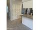 Pantry and breakfast bar featuring granite countertops and white cabinetry in kitchen at , Mesa, AZ 85205