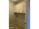 Laundry room featuring cabinetry, tile floors, and utility hookups at , Mesa, AZ 85205