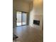 Bright living room with a fireplace, sliding glass doors, and tile flooring at , Mesa, AZ 85205