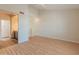 Bedroom with wood floors, high ceilings and view to the ensuite bath at 100 E Fillmore St # 227, Phoenix, AZ 85004