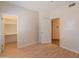 Bedroom with wood-look flooring and access to walk-in closet and ensuite at 100 E Fillmore St # 227, Phoenix, AZ 85004