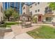 Inviting courtyard with pergola, benches, and lush green grass, perfect for relaxing and enjoying the outdoors at 100 E Fillmore St # 227, Phoenix, AZ 85004
