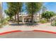 Inviting entrance to the community clubhouse, framed by lush greenery at 100 E Fillmore St # 227, Phoenix, AZ 85004
