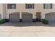 Charming townhome exteriors with private garages and well-maintained landscaping at 100 E Fillmore St # 227, Phoenix, AZ 85004