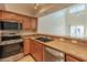Well-appointed kitchen with stainless steel appliances, granite countertops, and a convenient breakfast bar at 100 E Fillmore St # 227, Phoenix, AZ 85004