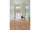 Bright living room with high ceilings, fireplace, ceiling fan and sliding glass doors at 100 E Fillmore St # 227, Phoenix, AZ 85004