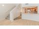 Hardwood floors, kitchen view, stairs and storage in the living room offer form and function at 100 E Fillmore St # 227, Phoenix, AZ 85004