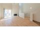 Bright living room features hardwood floors, high ceilings, a fireplace, and sliding glass doors to a balcony at 100 E Fillmore St # 227, Phoenix, AZ 85004