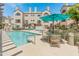 Sparkling community pool with inviting lounge chairs and patio seating for residents to enjoy at 100 E Fillmore St # 227, Phoenix, AZ 85004