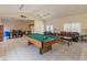 Recreation room featuring a billiards table, seating area, and dining area for residents at 100 E Fillmore St # 227, Phoenix, AZ 85004