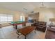 Spacious recreation room with billiards table, kitchen area, and comfortable seating area at 100 E Fillmore St # 227, Phoenix, AZ 85004