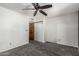 Bedroom with ceiling fan, carpet flooring, and sliding door closet at 1110 E Utopia Rd, Phoenix, AZ 85024