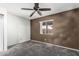 Cozy bedroom featuring plush carpet and a window with views of the outdoors at 1110 E Utopia Rd, Phoenix, AZ 85024