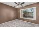 Bedroom featuring plush carpet flooring and a window with outdoor views at 1110 E Utopia Rd, Phoenix, AZ 85024