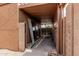 Carport with concrete flooring and ample overhead storage space, plus new sliding glass doors at 1110 E Utopia Rd, Phoenix, AZ 85024