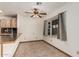Sunny dining nook with a window and open access to the kitchen's breakfast bar area at 1110 E Utopia Rd, Phoenix, AZ 85024