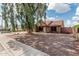 Charming home featuring a well-maintained front yard with mature tree, privacy fence, and a two-car garage at 1110 E Utopia Rd, Phoenix, AZ 85024