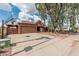 Desirable home with extended driveway, two-car garage, mature landscaping and privacy fence at 1110 E Utopia Rd, Phoenix, AZ 85024