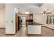 Bright, functional kitchen with dark countertops and wood cabinetry offering ample storage at 1110 E Utopia Rd, Phoenix, AZ 85024