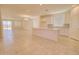 Bright open floorplan features a modern kitchen with a large island and stainless steel appliances at 1130 E Westwood Dr, Casa Grande, AZ 85122