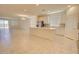 Spacious, open concept living and dining area features tile floors, and ample natural light from multiple windows at 1130 E Westwood Dr, Casa Grande, AZ 85122
