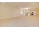 Open-concept living room with tile floors, recessed lighting, and views of the kitchen at 1130 E Westwood Dr, Casa Grande, AZ 85122
