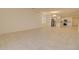 Bright living area featuring neutral color scheme, tile flooring, recessed lighting and chandelier over the dining space at 1130 E Westwood Dr, Casa Grande, AZ 85122